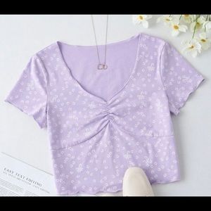 Light purple crop top with white flowers